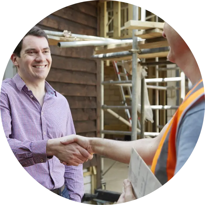 Construction worker shaking hands with a man