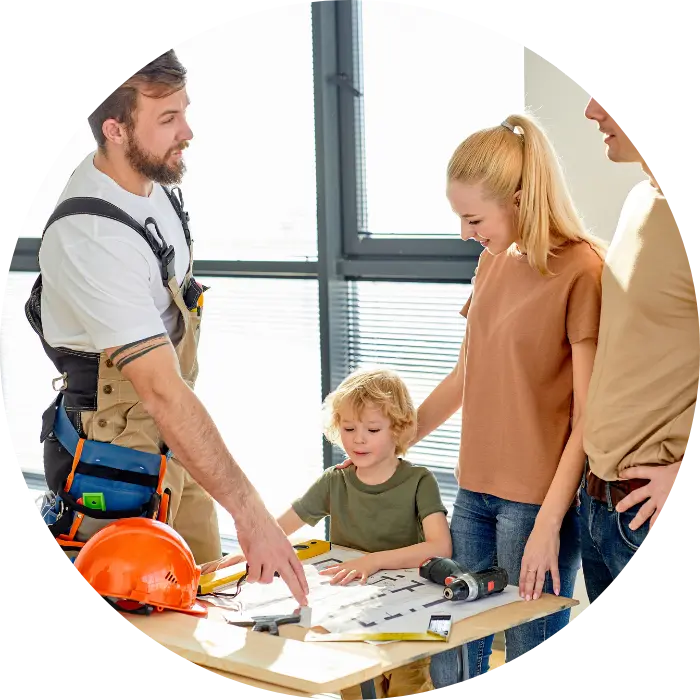 Construction worker showing plans to a family