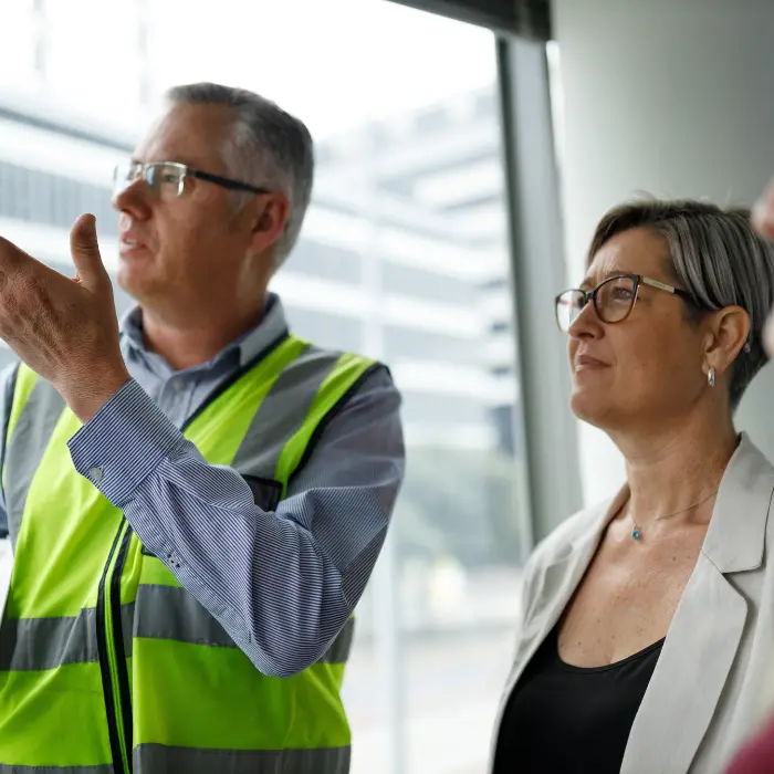 Construction worker in a meeting with a happy a client